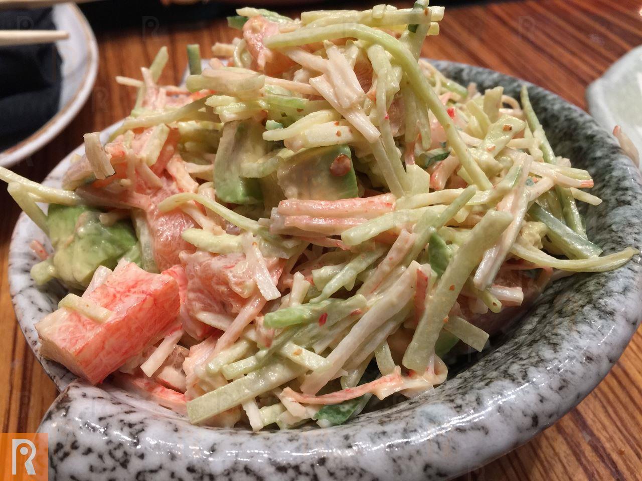 Salad contains Salmon, crabstick, avocado, cucumber, iceberg and spicy mayonnaise