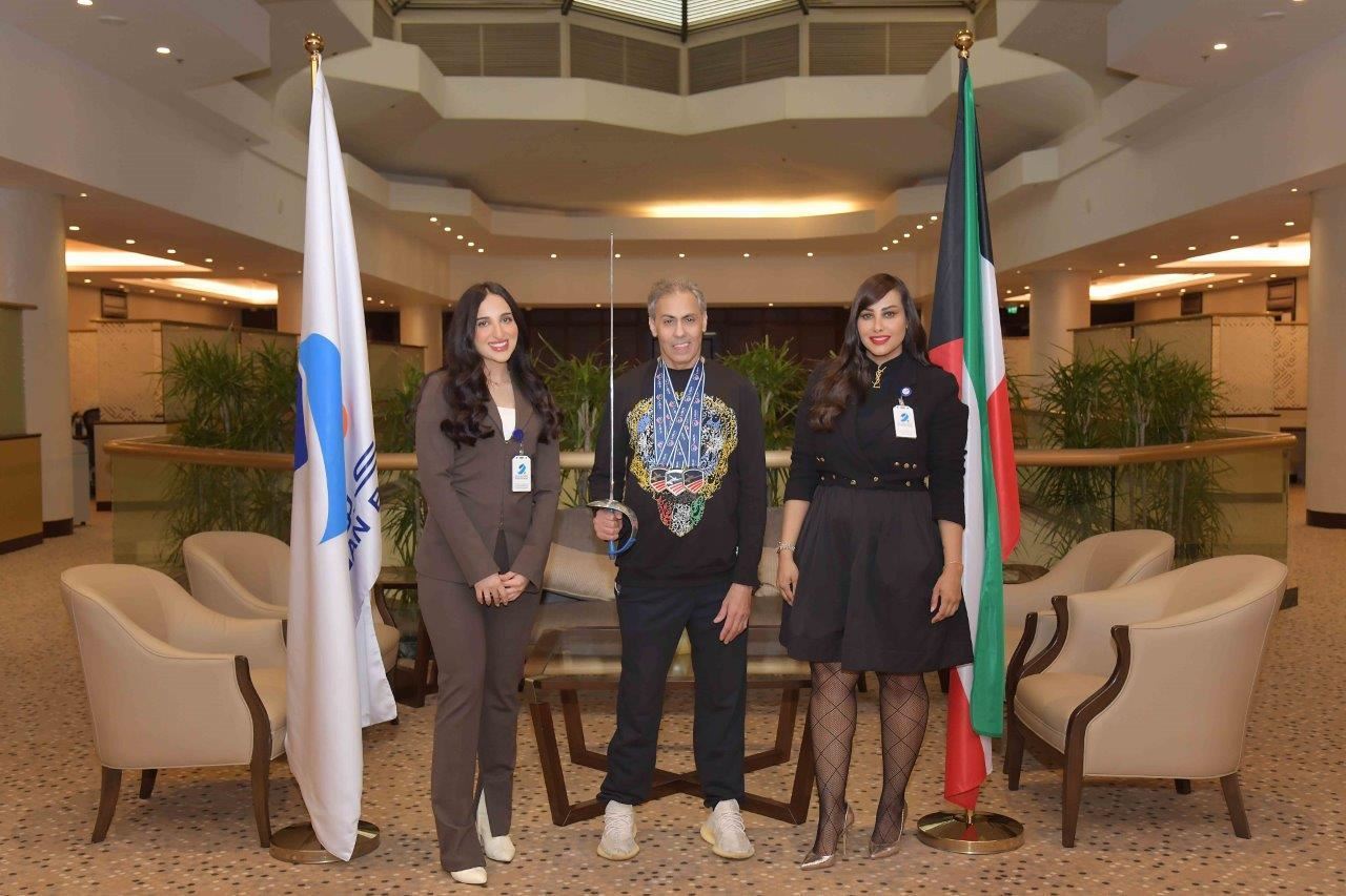 Mrs. Hessa Hussain Al-Najadah, Manager Public Relations at Burgan Bank, <br />with Ms. Leena Al-Bassam, Public Relations officer at Burgan Bank, <br />with Mr. Tareq AlQallaf, World Wheelchair Fencing Champion.