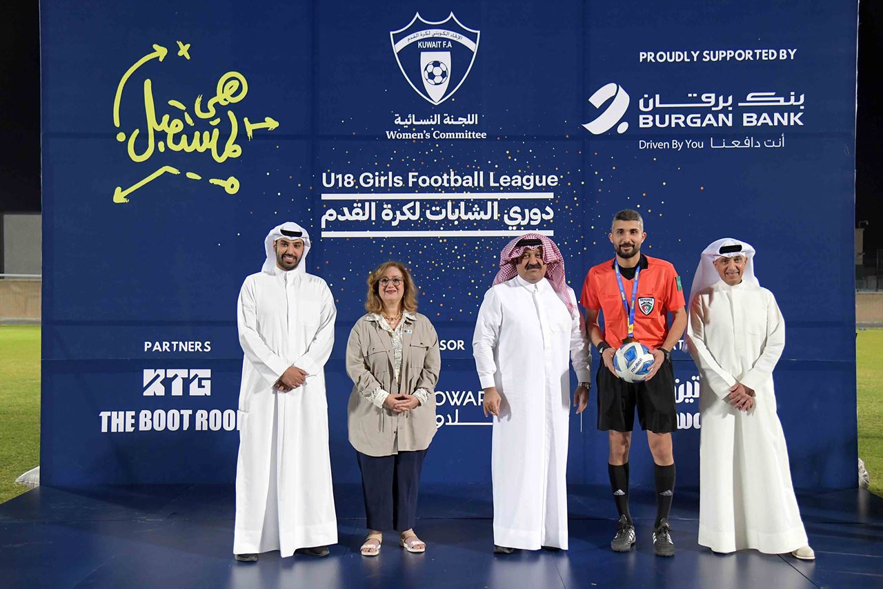 Sheikh Ahmed Al-Yousef, Chairman of the Board of Directors of the Kuwait Football Association, and Mrs. Kholoud Al-Feeli, Head of Communications & Public Relations Department at Burgan Bank 