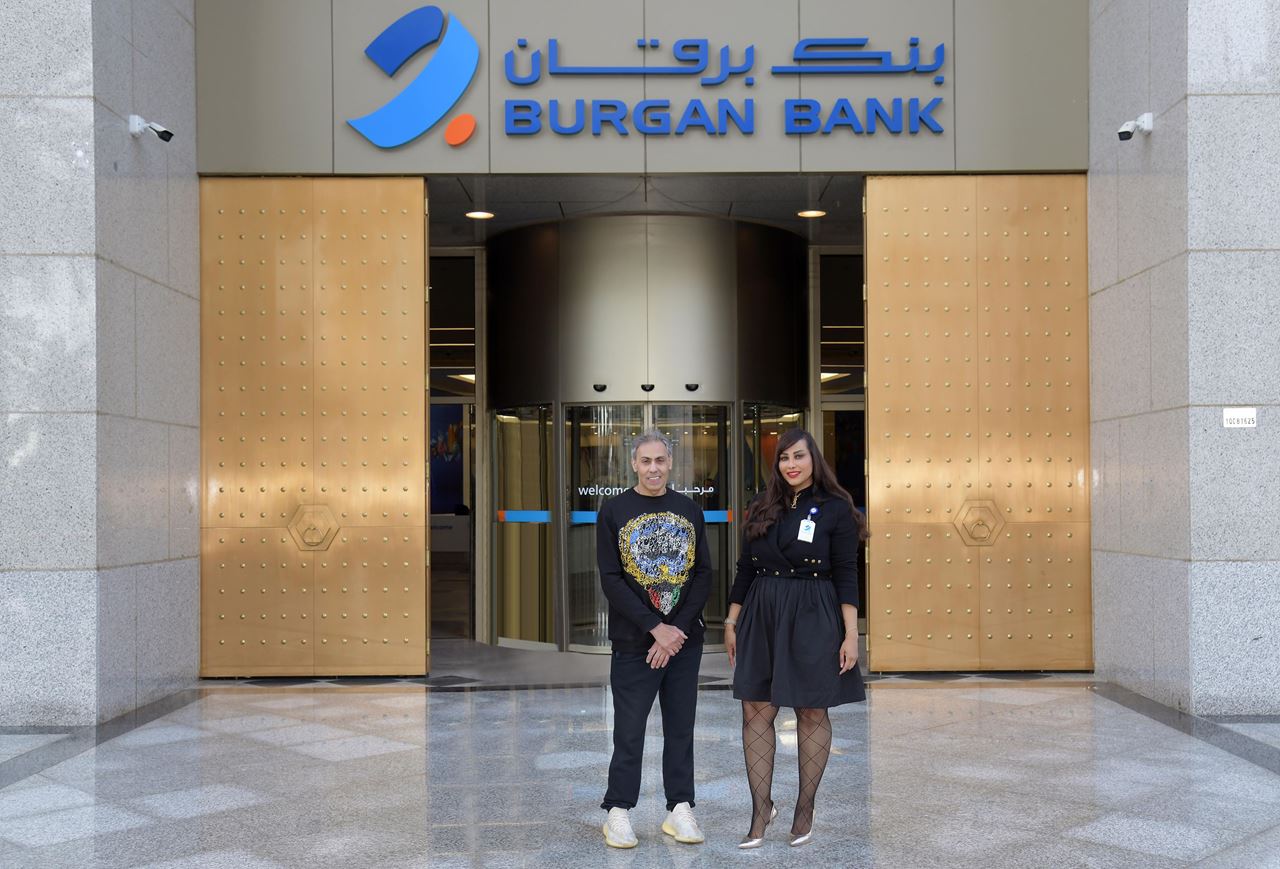 The champion Tareq Al-Qallaf with Ms. Hessa Hussain Al-Najadah, Senior Manager - Corporate and CSR Communications at Burgan Bank